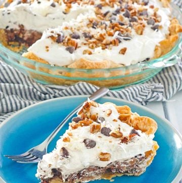 homemade Marie Callender's German Chocolate pie slice on a blue in front of the pie.