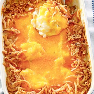mashed potato casserole with cheese and crispy fried onions on top.