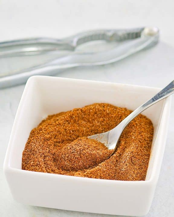 homemade old bay seasoning in a small square bowl.