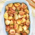 overhead view of parmesan potatoes in a serving dish.
