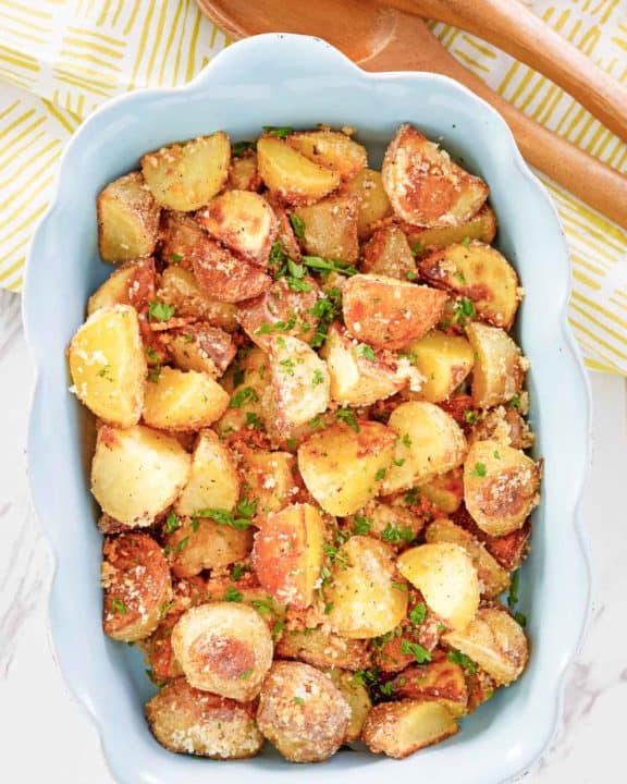 overhead view of parmesan potatoes in a serving dish.