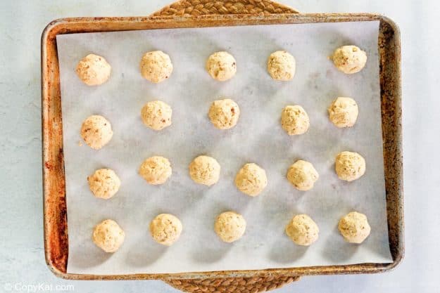 pecan sandies cookie dough balls on a baking sheet before baking.