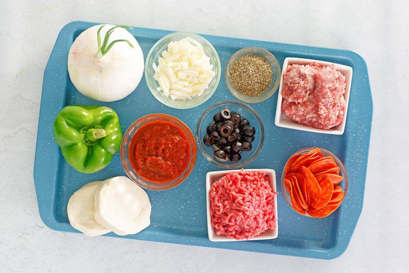 pizza monkey bread ingredients on a tray.