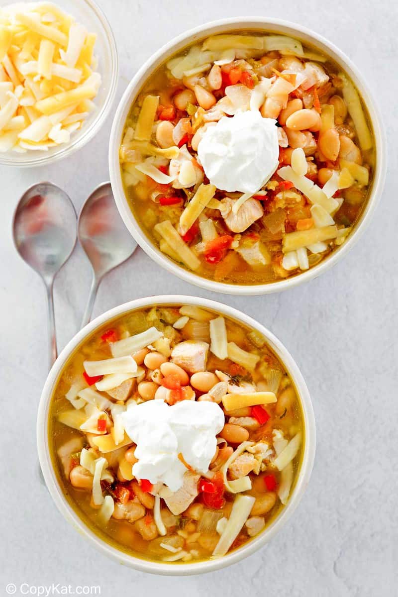 overhead view of white chicken chili in two bowls.