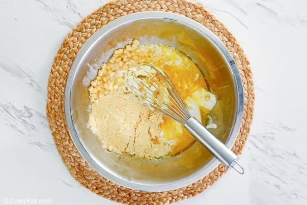 sour cream cornbread ingredients in a mixing bowl.