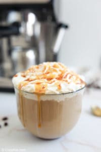 homemade Starbucks caramel latte in a glass mug.