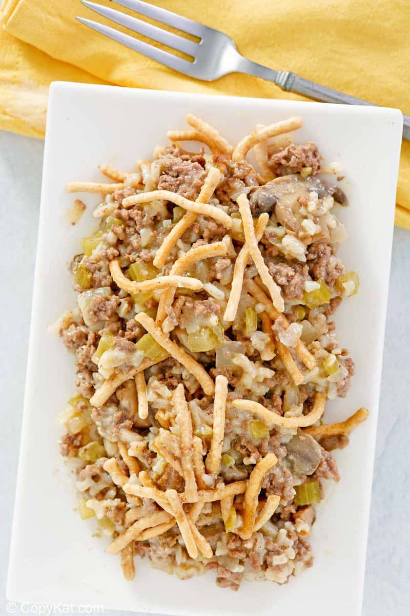 overhead view of American chop suey with rice on a platter.