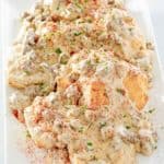 homemade Bob Evans sausage gravy and biscuits on a platter.