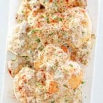 overhead view of Bob Evans sausage gravy and biscuits on a platter.