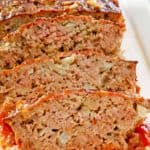 sliced brown sugar meatloaf on a platter.