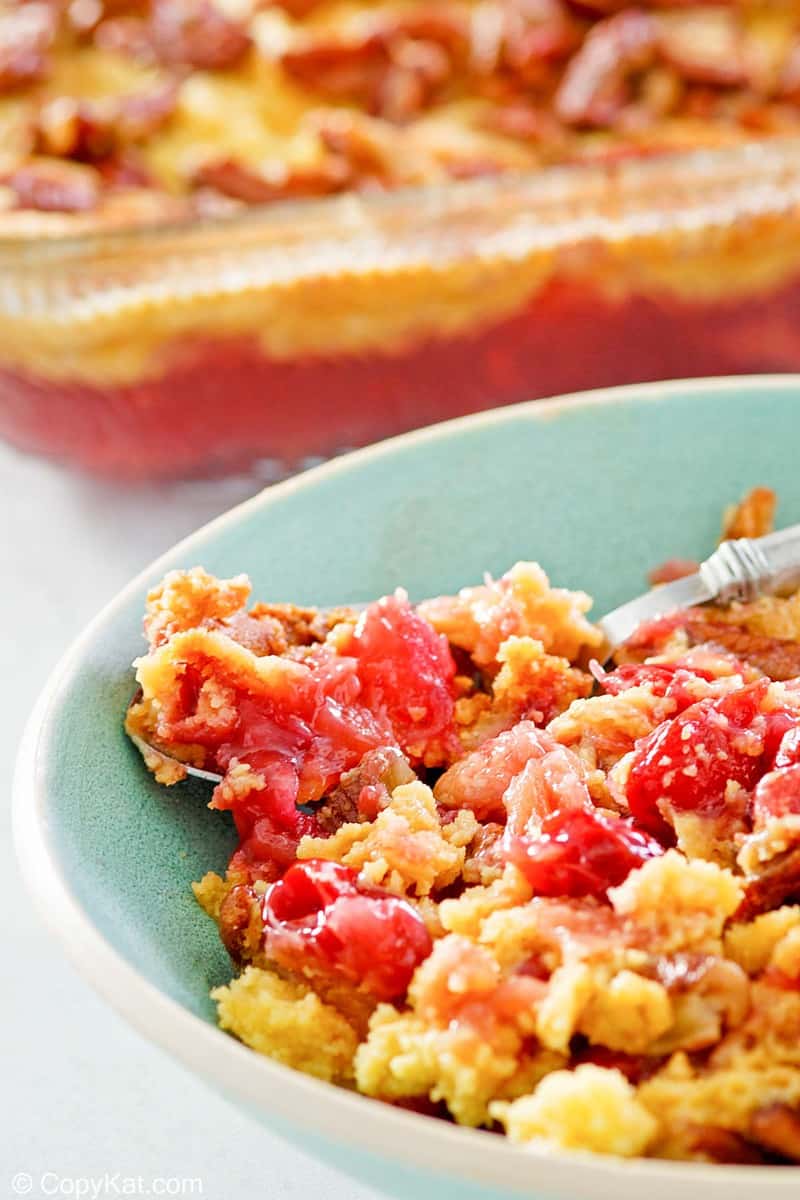 closeup of a serving of cherry pineapple dump cake.