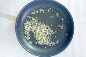 butter sauteed onions in a skillet.