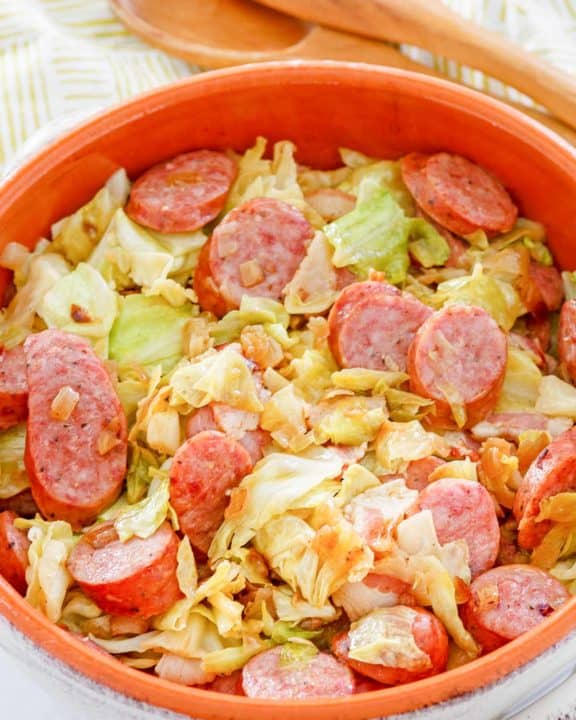 fried cabbage and sausage in a bowl.