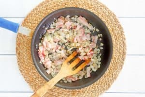 cooked chopped onions and bacon in a skillet.