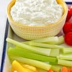 green goddess dip in a bowl and fresh vegetables in front of it.