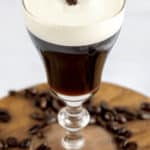 Irish coffee with a coffee bean on top.