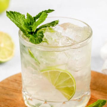 classic mojito cocktail on a wood board.