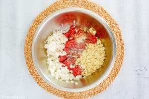 porcupine meatballs ingredients in a mixing bowl.