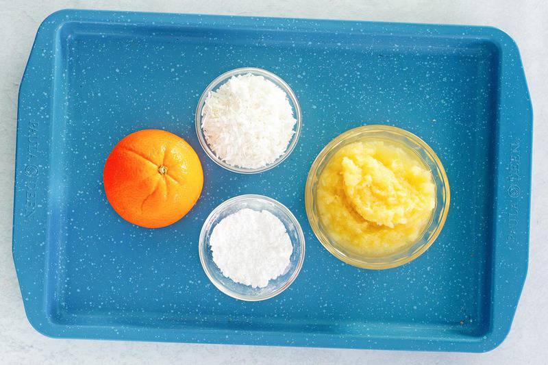 ambrosia fruit salad ingredients on a tray.