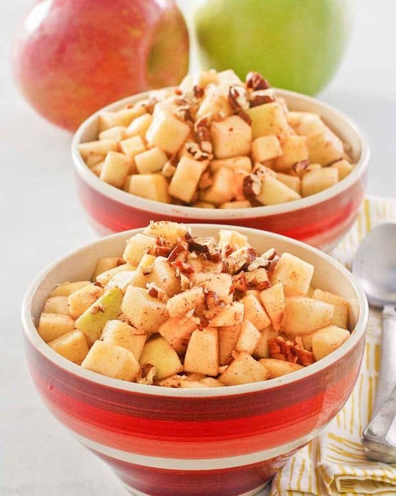charoset in two bowls and two apples.