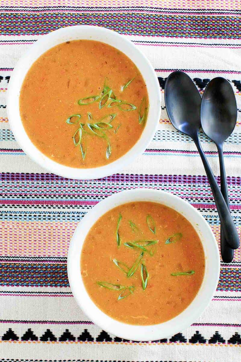 overhead view of two bowls of copycat Chili's chicken enchilada soup.