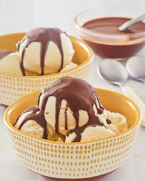 homemade chocolate magic shell on vanilla ice cream and in a bowl.