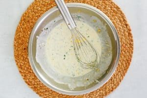 lemon caper sauce in a mixing bowl.