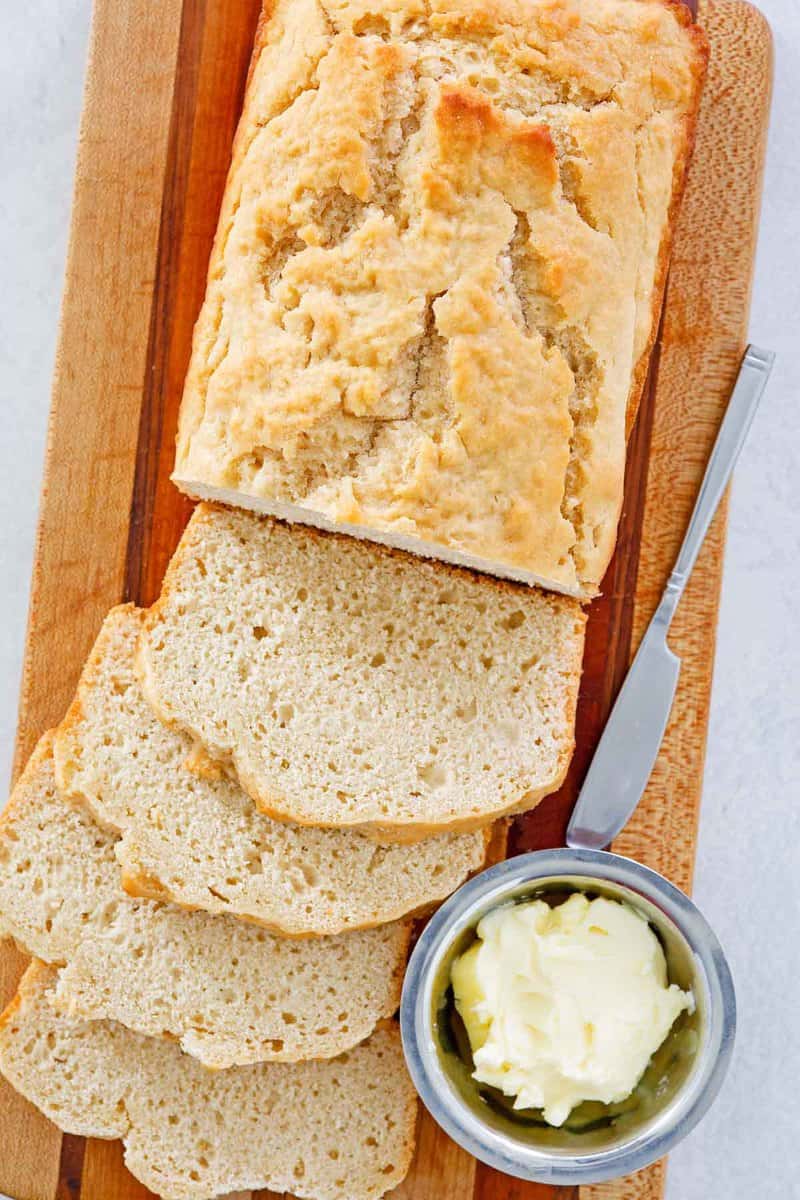 overhead view of homemade beer bread on a cutting board.