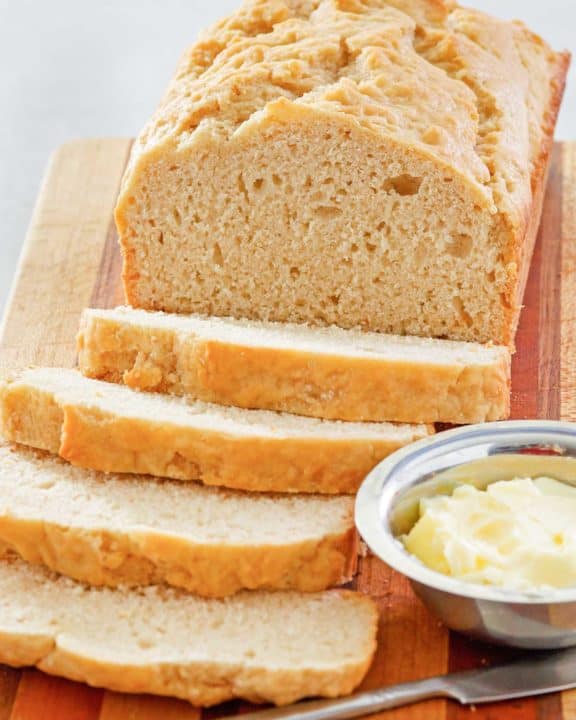 beer bread and butter on a cutting board.