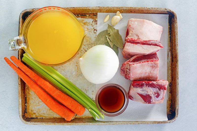 braised short ribs ingredients on a baking sheet.