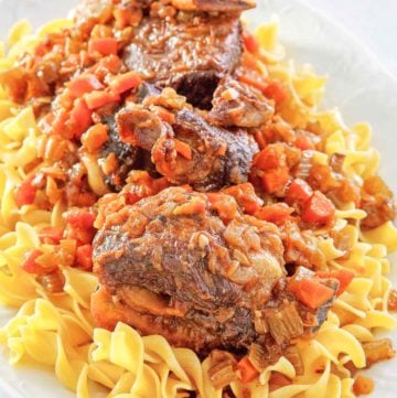 braised short ribs and noodles on a platter.