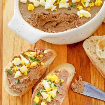 chicken liver pate on bread slices and in a dish.