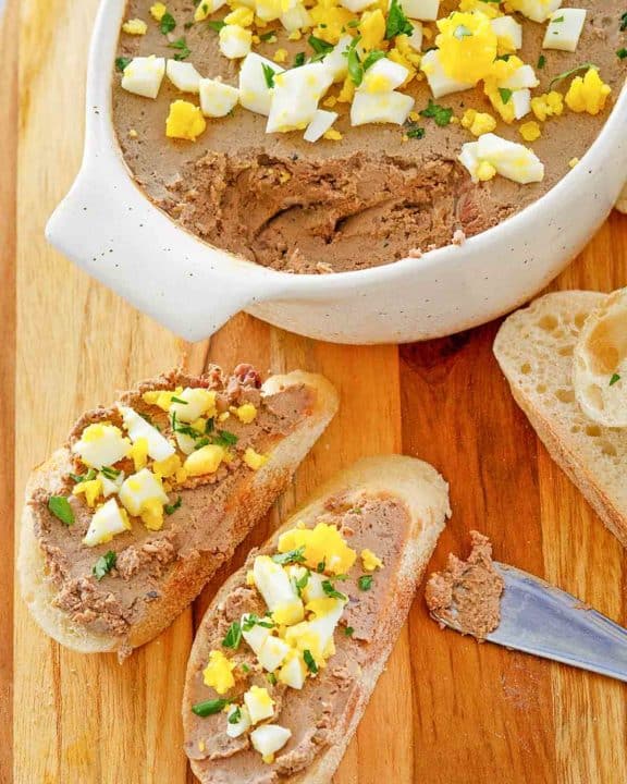 chicken liver pate on bread slices and in a dish.