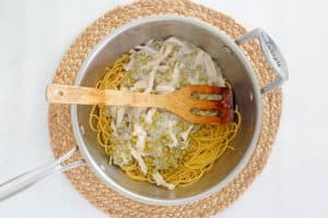 soup mixture, peas, and pasta noodles in a bowl.