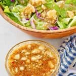 homemade Outback blue cheese vinaigrette dressing in a small bowl and on a salad.