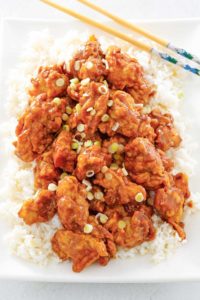 copycat Panda Express orange chicken and rice on a platter.