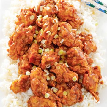 copycat Panda Express orange chicken and rice on a platter.