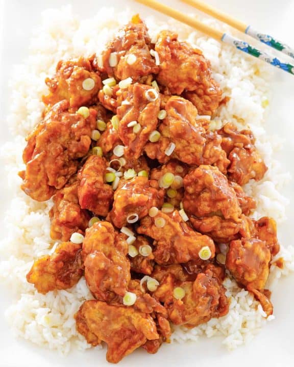 copycat Panda Express orange chicken and rice on a platter.