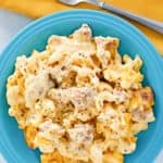 overhead view of sausage mac and cheese casserole on a plate.