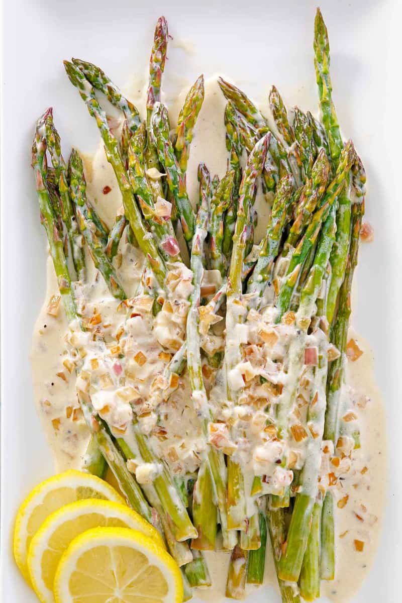 overhead view of sauteed asparagus with lemon cream sauce.