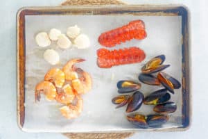 cooked seafood on a baking sheet.