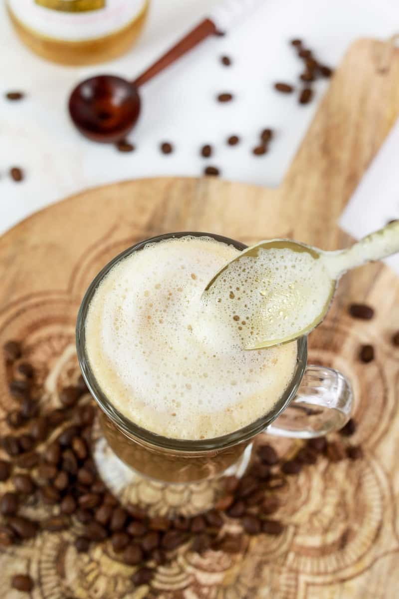 homemade Starbucks vanilla latte with a spoon over it.