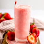 homemade Wendy's strawberry frosty with strawberries around it.