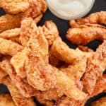 overhead view of beer battered chicken on a platter.
