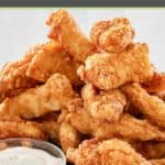 beer battered chicken tenders on a platter.