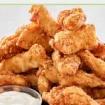beer battered chicken strips and dipping sauce.