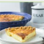 buttermilk pie slice on a plate in front of the pie.