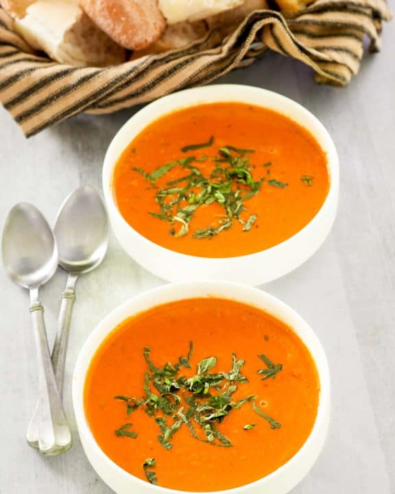 copycat La Madeleine tomato basil soup in two bowls.