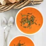 overhead view of bowls of copycat La Madeleine tomato basil soup.