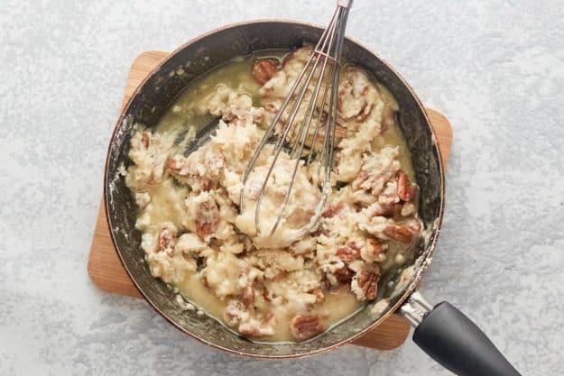 lemon lush crust mixture in a skillet.